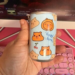 Capybara face and hand wipes in a can keychain